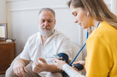 woman and man with sphygmomanometer